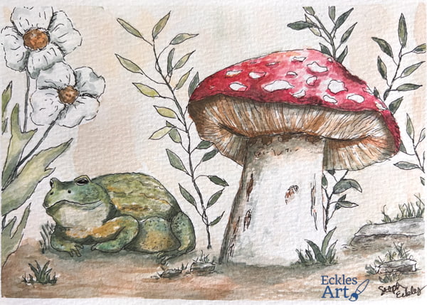 Dogwood flowers and leafy new stems frame the primary scene showing a small happy green toad resting close to a nearby toadstool mushroom with a bright red top and white jagged spots. There is a woodsy, almost vintage vibe with the muted green and brown palette, and each object is outlined in black ink.